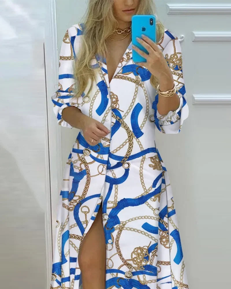Women's white polo neck shirt dress featuring blue and gold chain print, long sleeves, single-breasted closure, and ankle-length fit with side slit.
